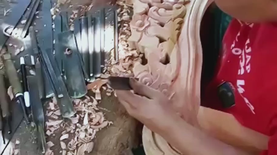 Working Around the Frame — The ornament continues along the curved frame, shaped section by section.
