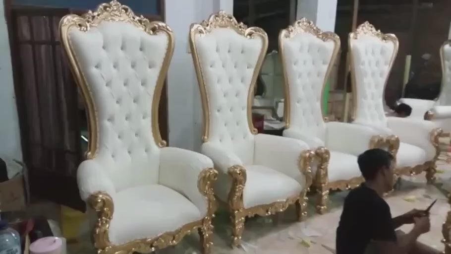 The Thrones Take Shape — A workshop view of white-and-gold thrones as the final work comes together.