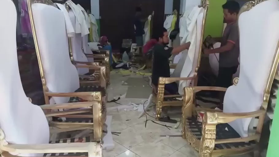 Building the Upholstery — Inside the workshop, upholstered backs take shape within the finished frames.